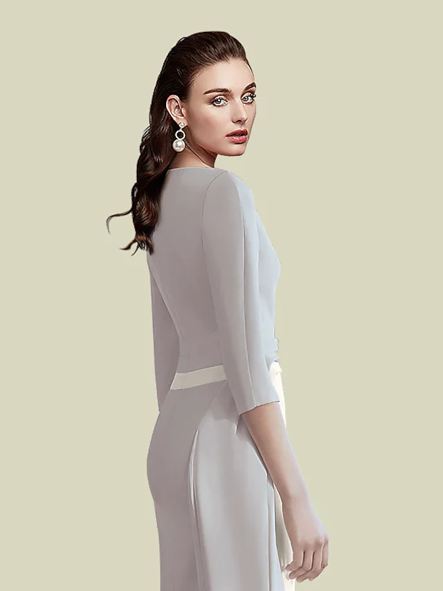 Close-up of the jewel neck and half sleeves on the dark blue mother of the bride dress.