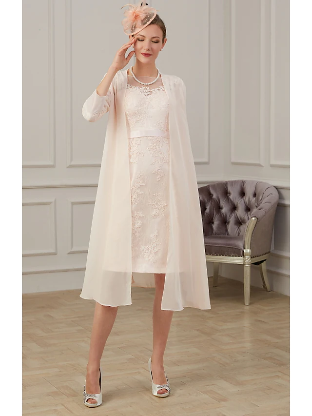 Close-up of the jewel neck and long sleeve with appliques on the chiffon dress.