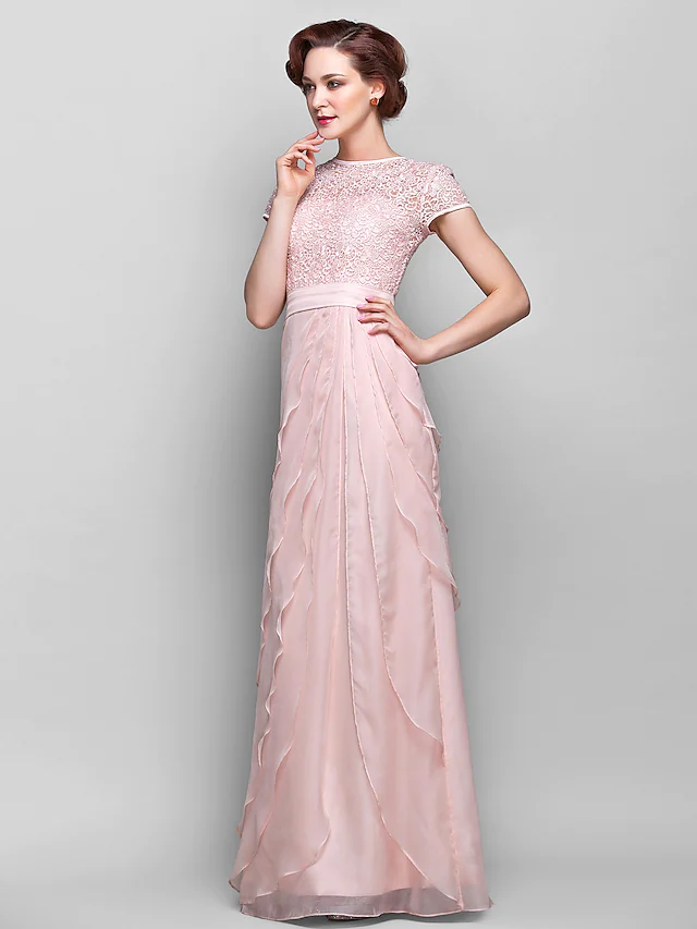 Close-up of the intricate lace and ruffle details on the dress.