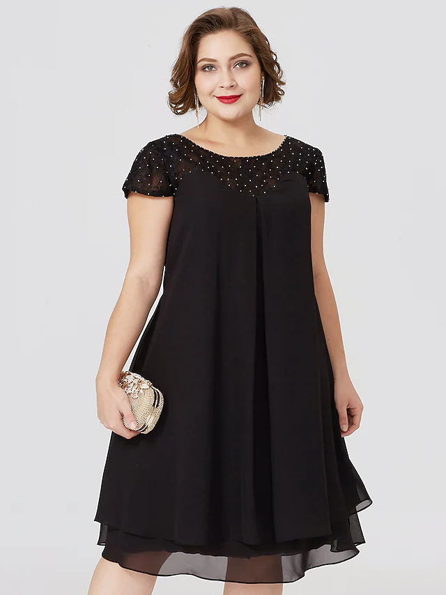 Plus size black Mother of the Bride dress with jewel neck, short sleeves, chiffon lace, pleats, and beading.