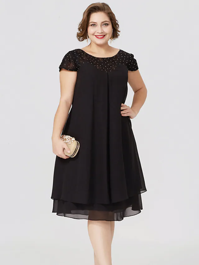 Plus size black Mother of the Bride dress with jewel neck, short sleeves, chiffon lace, pleats, and beading.