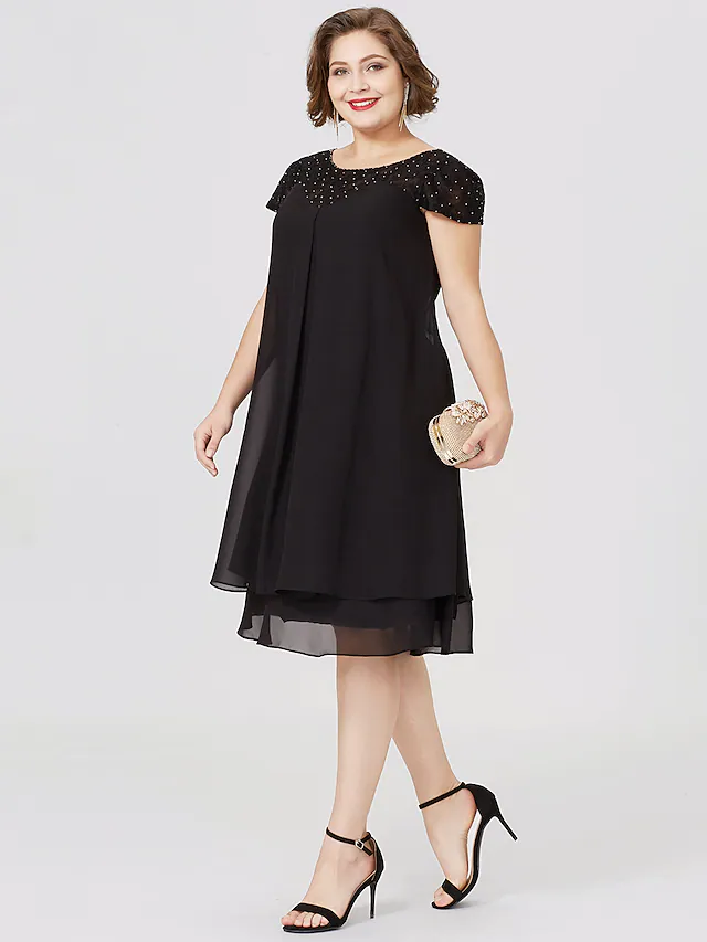 Plus size black Mother of the Bride dress with jewel neck, short sleeves, chiffon lace, pleats, and beading.
