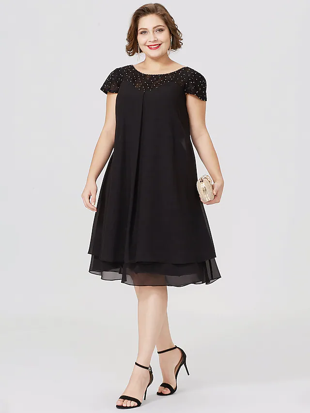 Plus size black Mother of the Bride dress with jewel neck, short sleeves, chiffon lace, pleats, and beading.