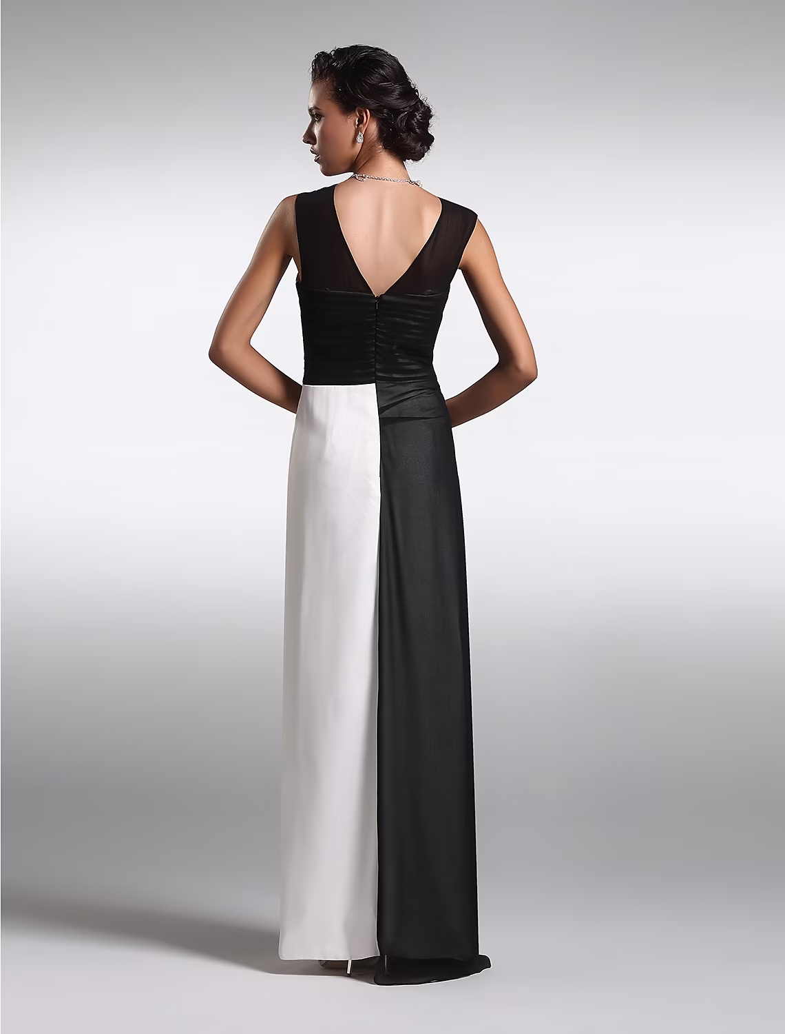 Back view of the black sheath dress, showcasing the V-back design.
