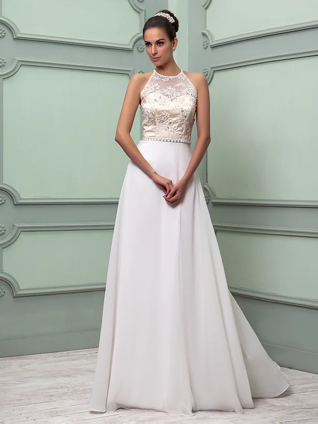 Back view of a chiffon and lace wedding dress with regular straps.