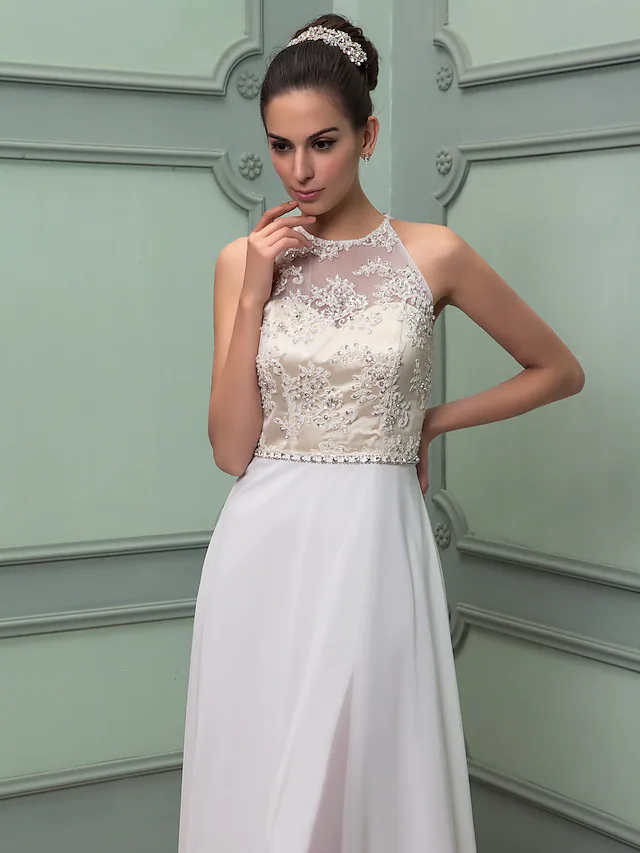 Detail of the see-through lace elements and beading on the wedding dress.