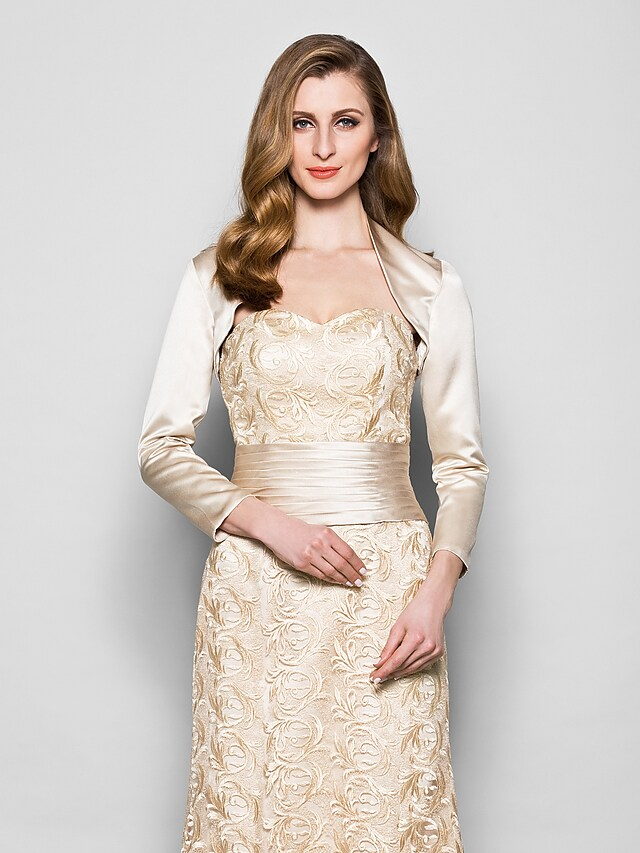 Close-up of the sweetheart neckline and delicate 3/4 lace sleeves on the formal dress.