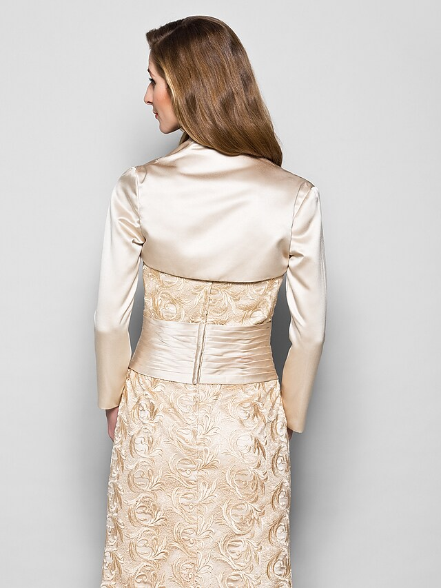 Detail of the ruched satin fabric and included wrap on the Mother of the Bride gown.