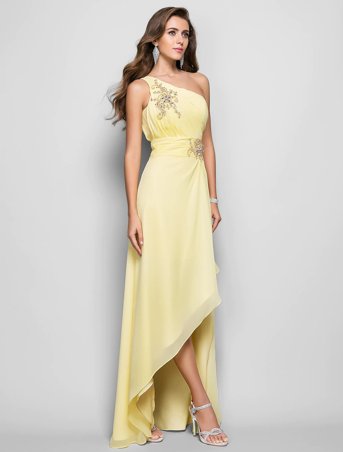 Elegant one-shoulder sheath dress with beading and a high slit.