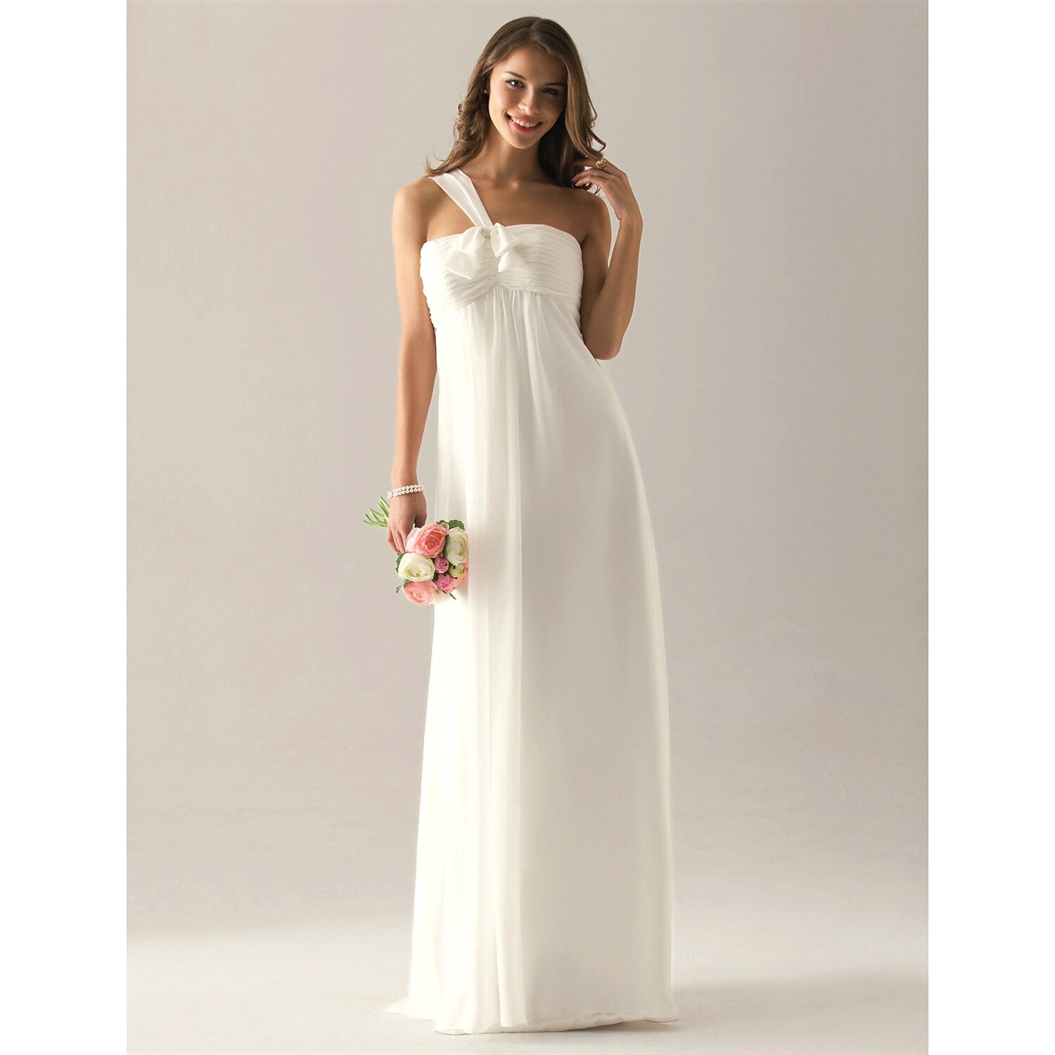 Detail of the flowing floor-length skirt of the bridesmaid gown.