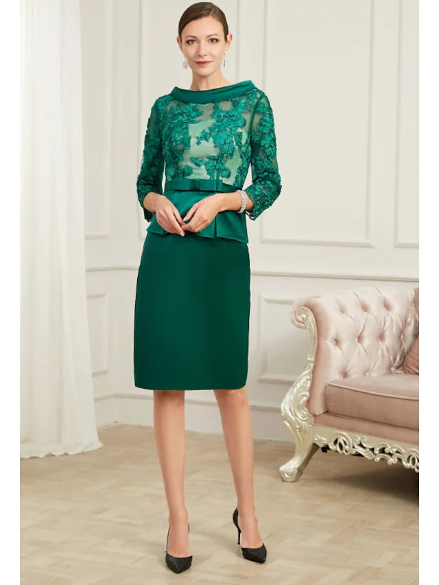 Elegant sheath peplum chiffon dress with jewel neck and 3/4 sleeves.