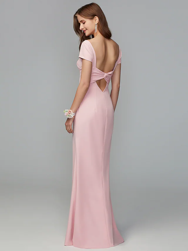 Back view of the bridesmaid dress featuring criss-cross draping and an open back.