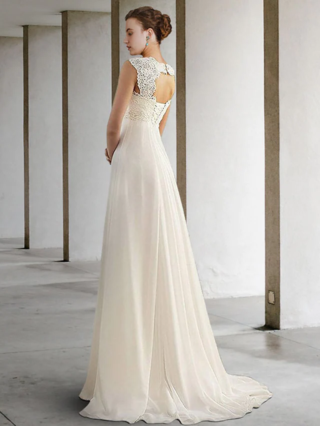 Back view of a white wedding dress featuring pleats and delicate appliques.