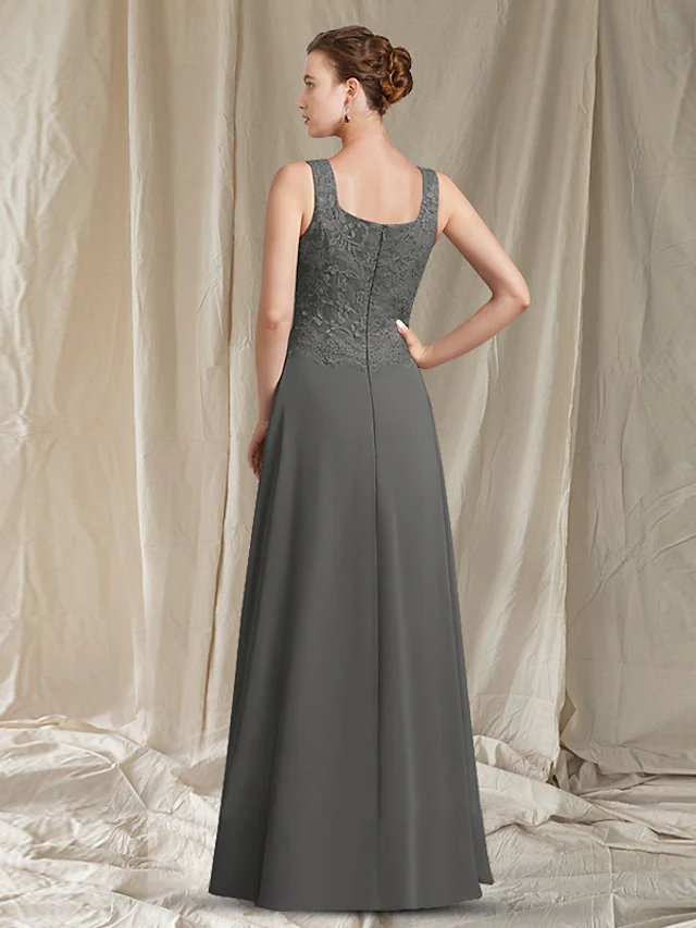 Close-up of the square neckline and delicate lace detail on the elegant dress.