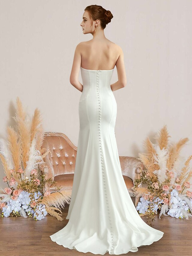 Back view of the strapless chiffon wedding dress, highlighting the backless design.