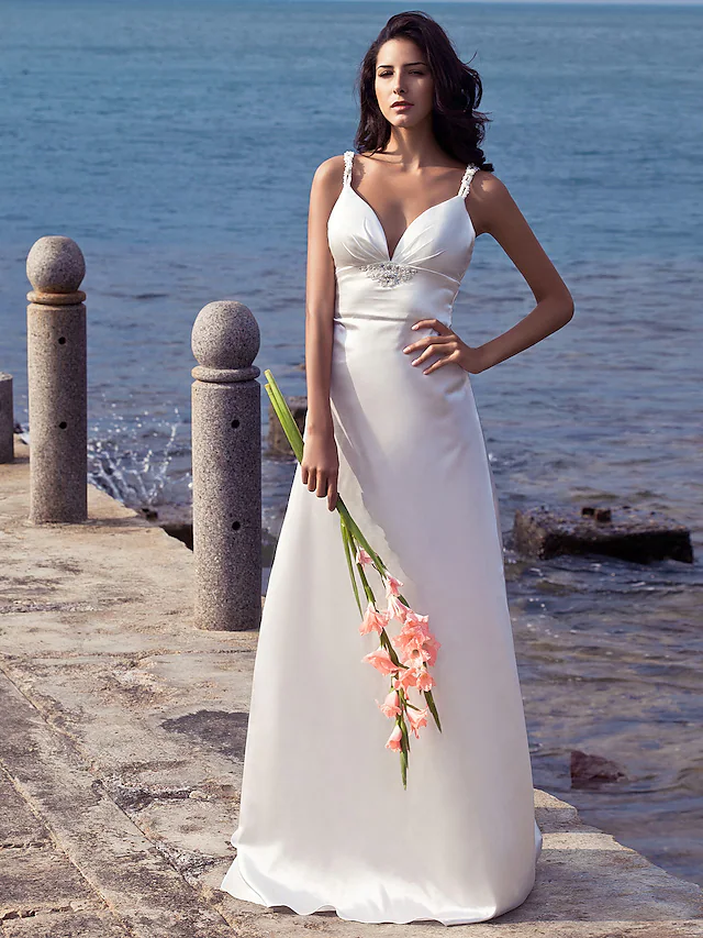 Elegant sheath wedding dress with sweetheart neckline and spaghetti straps.