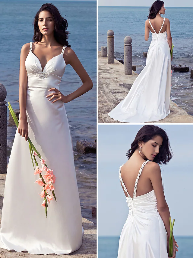Back view of stretch satin wedding dress with open back and intricate beading.