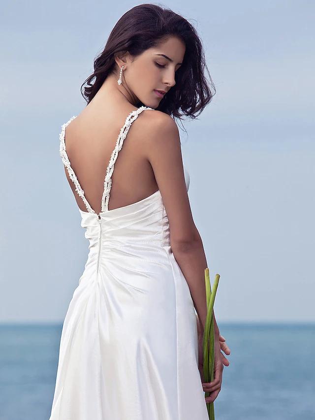 Flowing stretch satin fabric detail on a modern bridal dress.