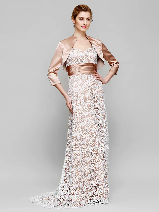 Full-length view of an elegant dark blue Mother of the Bride sheath dress with V-neck and 3/4 lace sleeves.