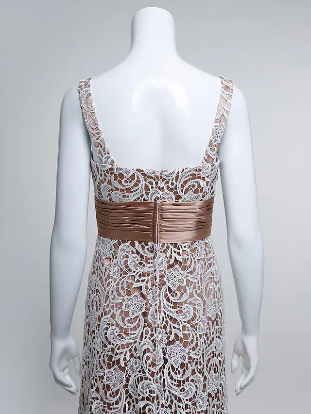 Detail of the 3/4 length sleeve with delicate lace trim on the dark blue Mother of the Bride dress.