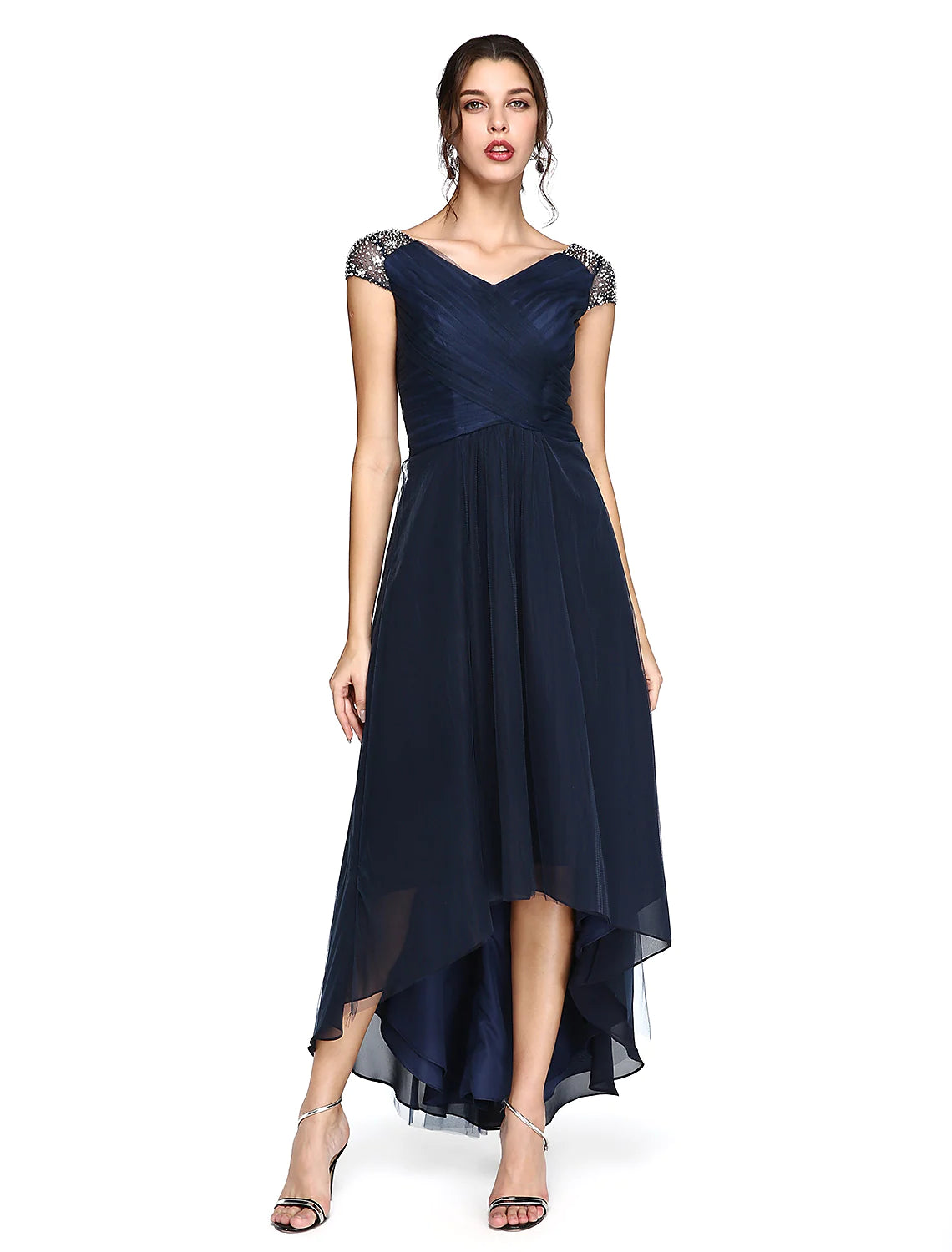 Back view of the dress, highlighting the V-back and criss-cross pleats.