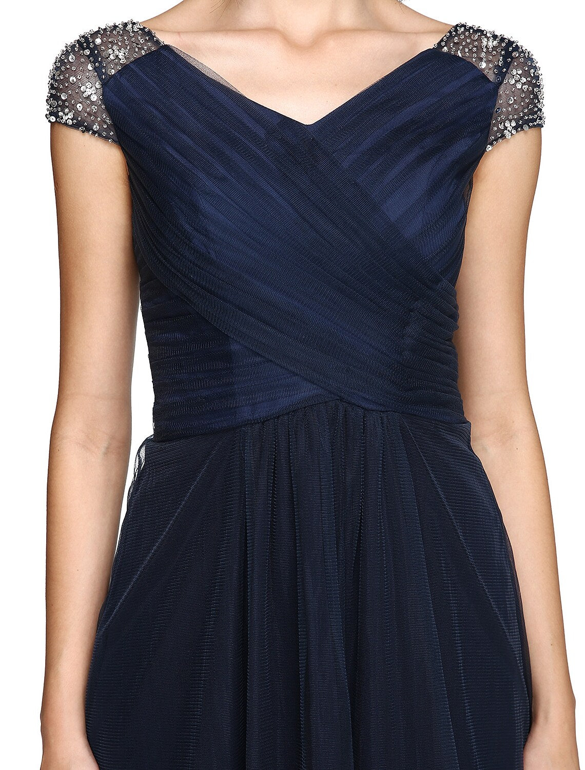 Detail of the delicate beading and tulle accents on the midi dress.