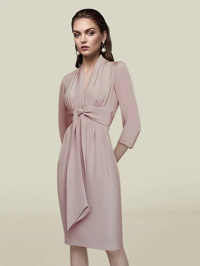 Model wearing an elegant knee-length V-neck charmeuse dress with 3/4 sleeves and a sash.