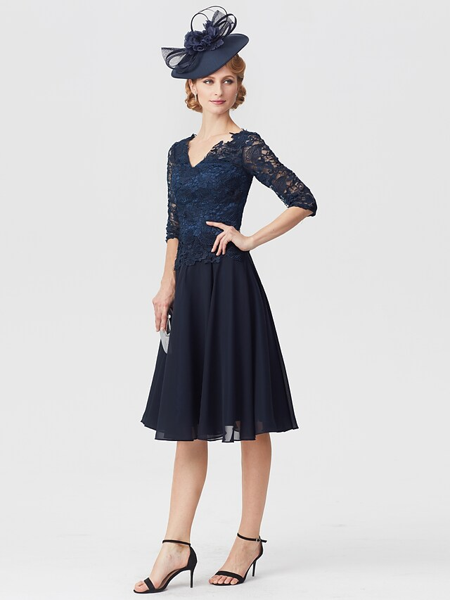 Back view of the elegant mother of the bride dress with lace details.