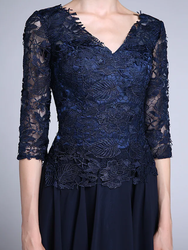 Close-up of the delicate sheer lace half sleeve on the dress.