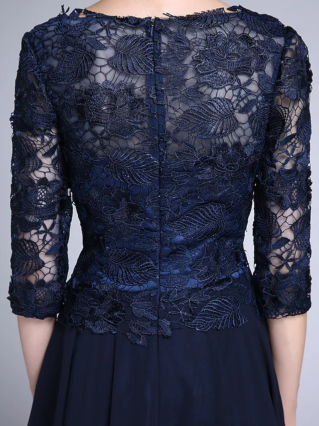 Model wearing the V-neck chiffon lace dress, posing gracefully.
