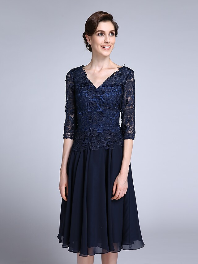 Detail of the V-neckline and lace bodice of the formal dress.