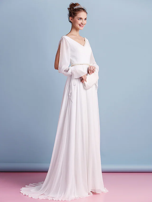 Back view of the wedding dress, highlighting the court train.