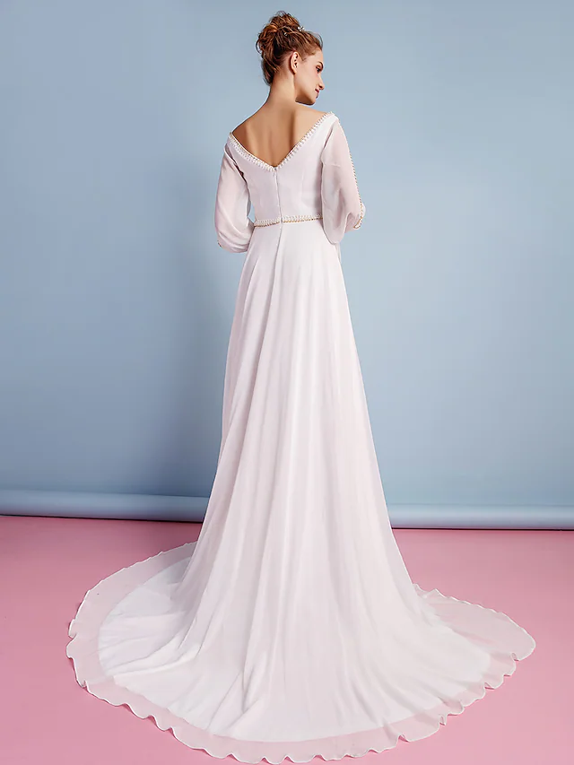 Full length view of the elegant V-neck bridal gown.