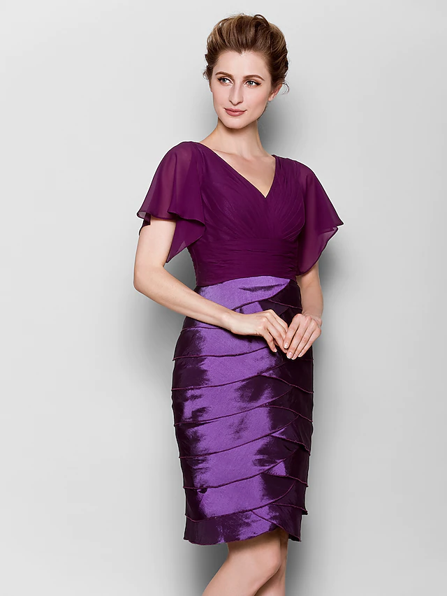 Close-up of V-neckline and short sleeve detail.