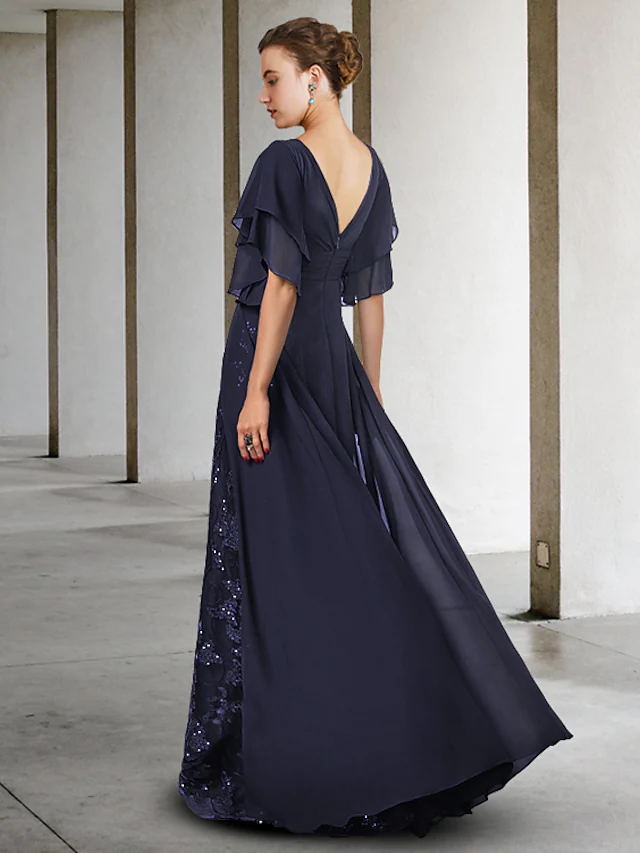 Side view of the floor-length sheath mother of the bride dress, featuring lace and sequin details.
