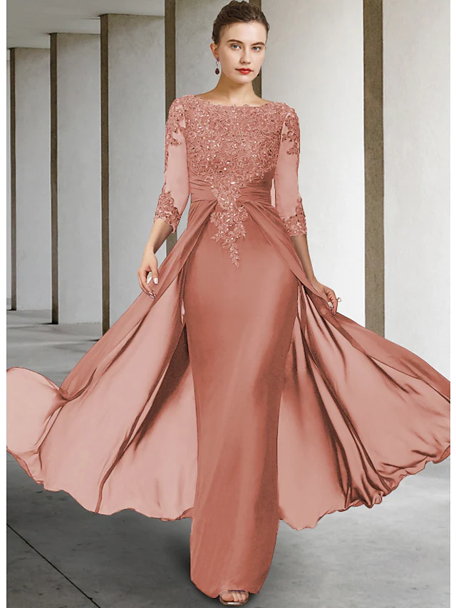 Woman modeling the elegant floor-length Mother of the Bride dress.