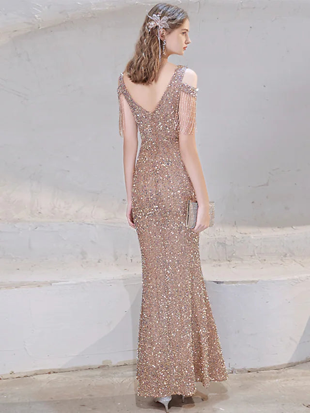 Close-up of the sequin and beading details on the elegant dress.