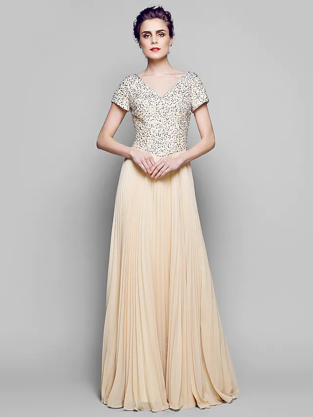 Back view of the floor-length mother of the bride dress, showing its flowing design.