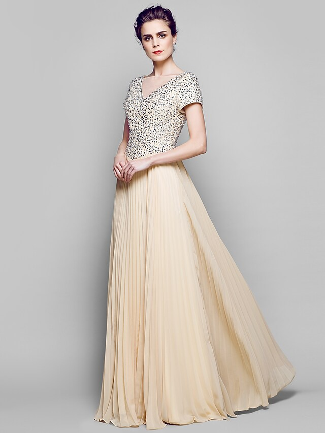 Close-up of the sparkling sequin and chiffon tulle fabric on the dress.