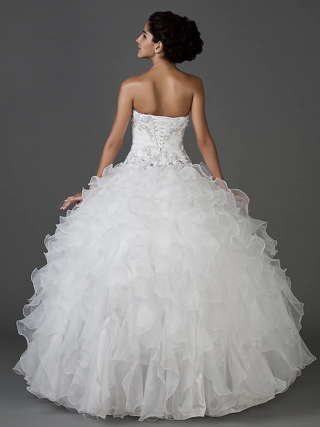 Back view of the elegant white ball gown wedding dress.