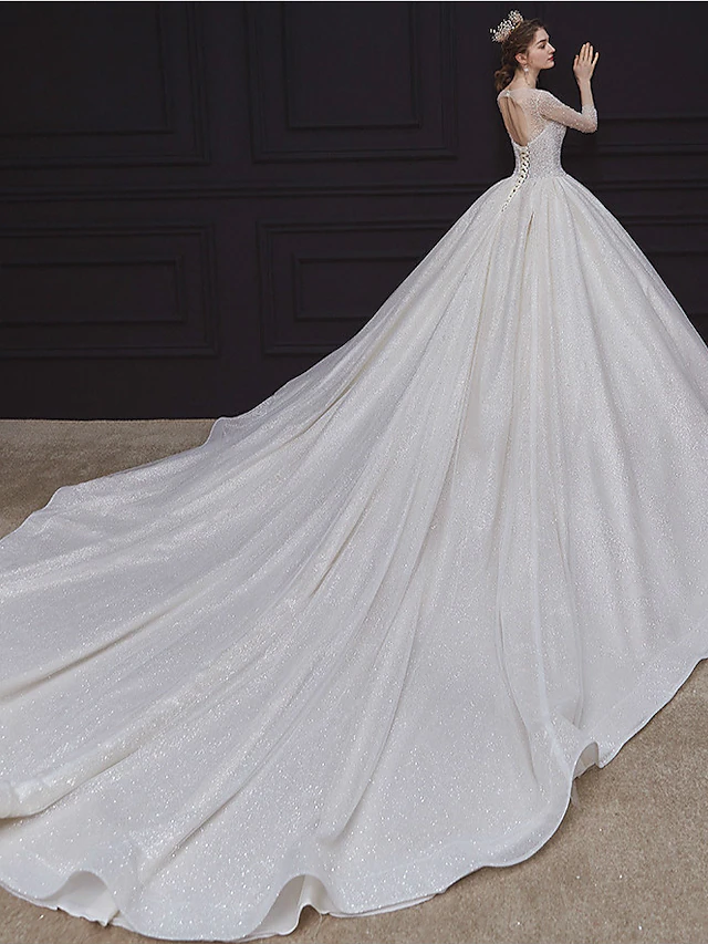 Close-up of the intricate beading and sequin details on the wedding gown.