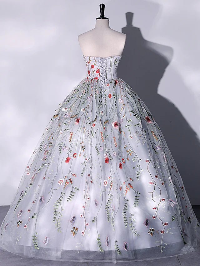Back view of a strapless Quinceanera ball gown featuring intricate embroidery.