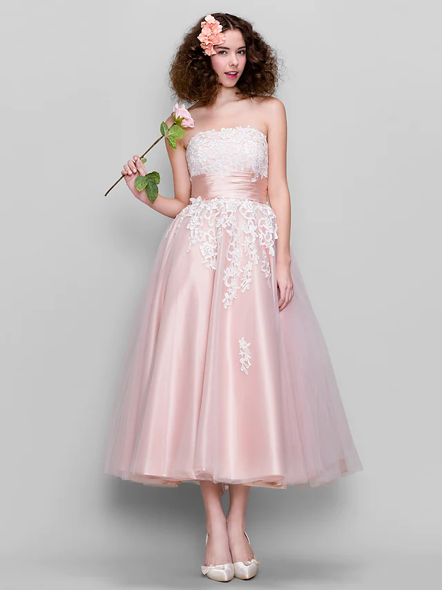 Elegant strapless ball gown with appliques.
