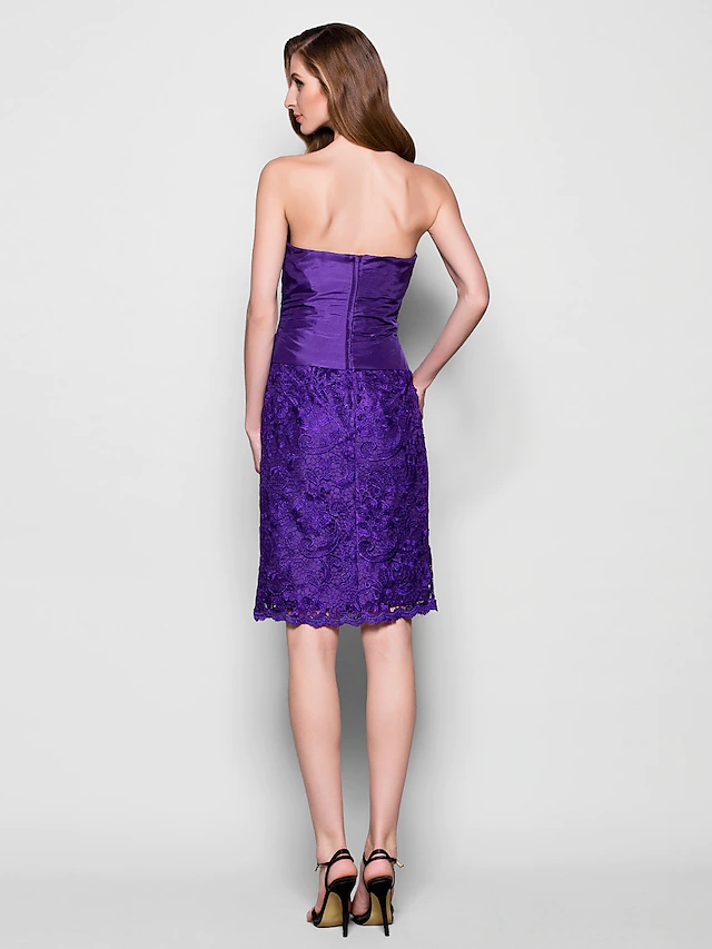 Close-up of the lace and pleat details on the strapless dress.