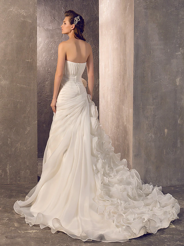 Detail of the cascading ruffle and sheer organza fabric on the bridal gown.