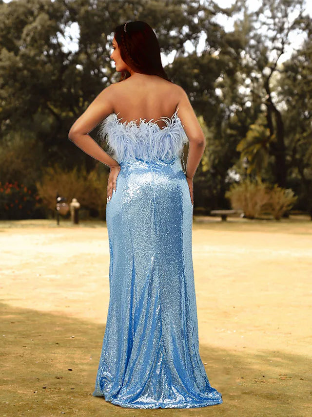 Back view of the sequined and feathered plus size formal gown with a sweep train.
