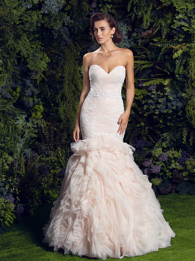 Close-up of lace appliques on a tulle wedding dress.