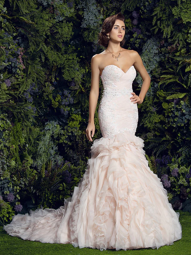 Full length view of a vintage-inspired mermaid bridal gown.