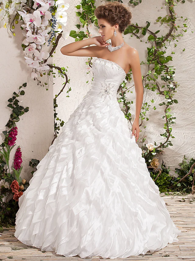Back view of strapless taffeta wedding dress with criss-cross detail.