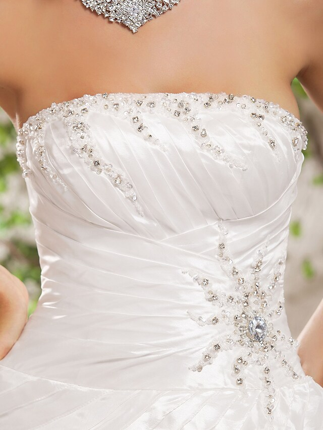 Detail of the cascading ruffles on the wedding dress.